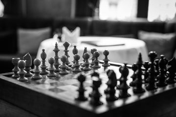 Chess board set up at the beginning of a game- jez-timms-unsplash