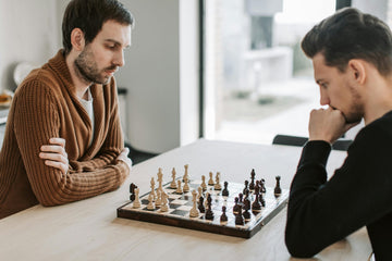 Two men over chess board.